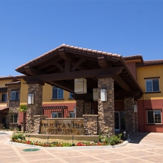 Entrance of senior living facility on a clear day