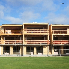 Front facing view of building still under construction.